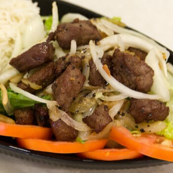 25. Filet Mignon Loc Lak Over Rice.